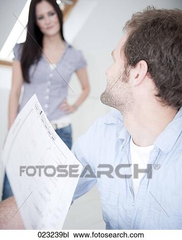 young couple at home looking at each other View Large Photo Image Stock Image - young couple at home looking at each other. Fotosearch