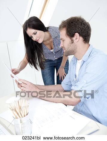 young couple at home studying document together View Large Photo Image Stock Image - young couple at home studying document together. Fotosearch