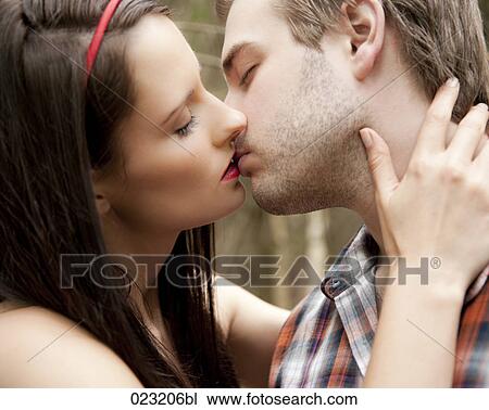 young couple kissing each other View Large Photo Image Stock Image - young couple kissing each other. Fotosearch