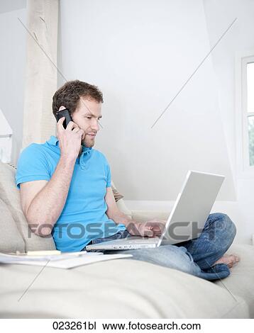 young man at home working with laptop computer View Large Photo Image Stock Image - young man at home working with laptop computer. Fotosearch