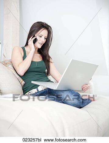 young woman at home working with laptop computer View Large Photo Image Stock Image - young woman at home working with laptop computer. Fotosearch