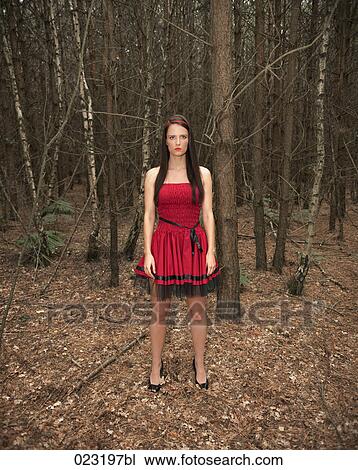 young woman in red dress in a forest View Large Photo Image Stock Image - young woman in red dress in a forest. Fotosearch