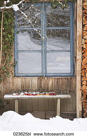 apples on bench in front of house in winter View Large Photo Image Stock Image - apples on bench in front of house in winter. Fotosearch