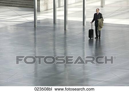 businessman standing in hall View Large Photo Image Stock Image - businessman standing in hall. Fotosearch