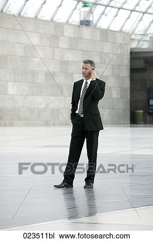 businessman talking on mobile phone View Large Photo Image Stock Image - businessman talking on mobile phone. Fotosearch