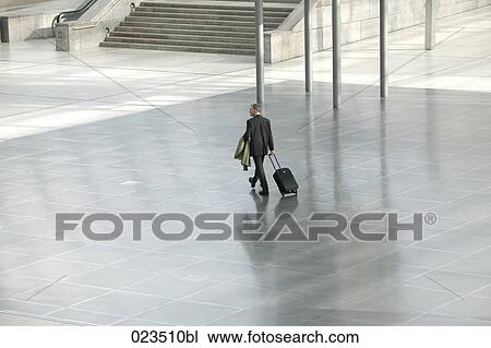 businessman walking through hall View Large Photo Image Stock Image - businessman walking through hall. Fotosearch