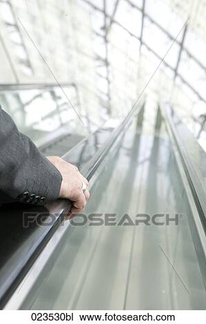 detail of businessman on escalator View Large Photo Image Stock Image - detail of businessman on escalator. Fotosearch