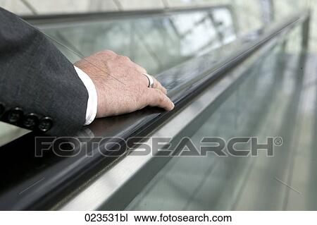 detail of businessman on escalator View Large Photo Image Stock Image - detail of businessman on escalator. Fotosearch