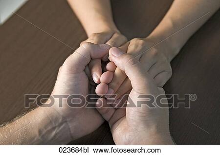detail of young couple holding hands View Large Photo Image Stock Image - detail of young couple holding hands. Fotosearch