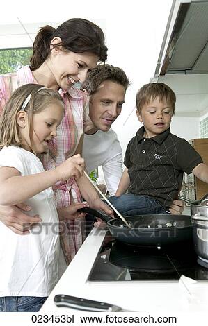 family cooking together in kitchen View Large Photo Image Stock Image - family cooking together in kitchen. Fotosearch