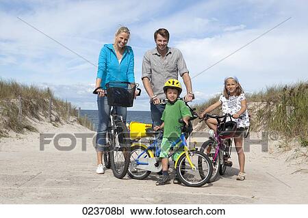 family cycling together at seaside View Large Photo Image Stock Image - family cycling together at seaside. Fotosearch