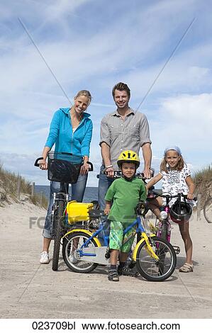 family cycling together at seaside View Large Photo Image Stock Image - family cycling together at seaside. Fotosearch