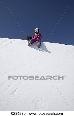 female snowboarder sitting on snow View Large Photo Image Stock Image - female snowboarder sitting on snow. Fotosearch