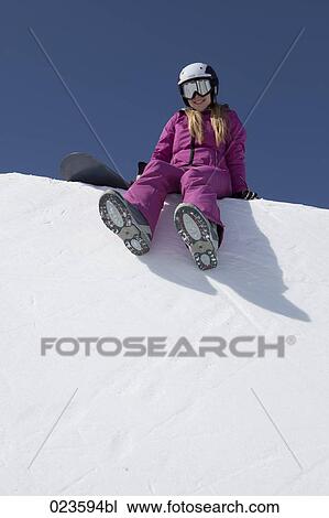 female snowboarder sitting on snow View Large Photo Image Stock Image - female snowboarder sitting on snow. Fotosearch