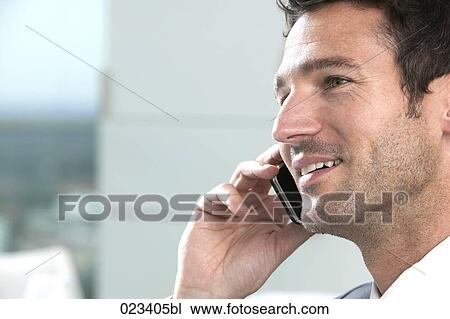 headshot of businessman talking on mobile phone View Large Photo Image Stock Image - headshot of businessman talking on mobile phone. Fotosearch