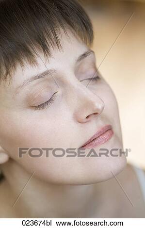 Stock Image - headshot of young woman. Fotosearch