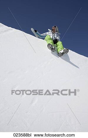 male skier sitting on snow View Large Photo Image Stock Image - male skier sitting on snow. Fotosearch