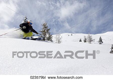 man skiing in the alps View Large Photo Image Stock Image - man skiing in the alps. Fotosearch