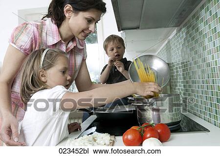 mother cooking with her children View Large Photo Image Stock Image - mother cooking with her children. Fotosearch