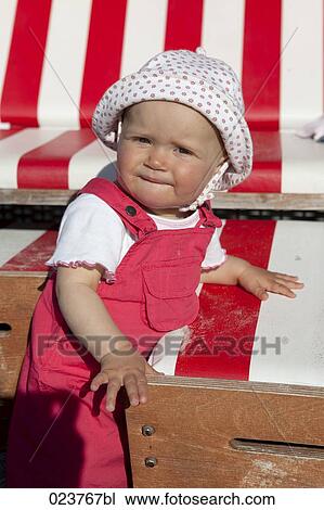 portrait of baby girl at beach chair View Large Photo Image Stock Image - portrait of baby girl at beach chair. Fotosearch