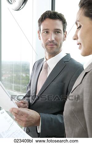 portrait of businessman and businesswoman having conversation View Large Photo Image Stock Image - portrait of businessman and businesswoman having conversation. Fotosearch