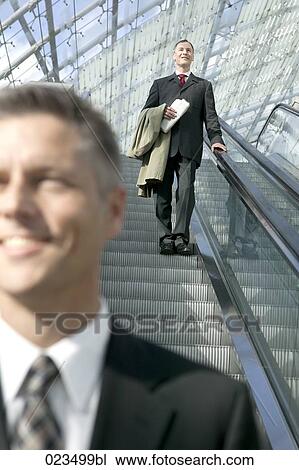 portrait of businessman on escalator View Large Photo Image Stock Image - portrait of businessman on escalator. Fotosearch