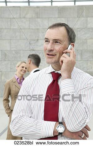 portrait of businessman talking on mobile phone View Large Photo Image Stock Image - portrait of businessman talking on mobile phone. Fotosearch