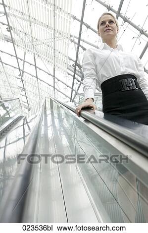 portrait of businesswoman on escalator View Large Photo Image Stock Image - portrait of businesswoman on escalator. Fotosearch