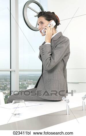 portrait of businesswoman talking on telephone in conference room View Large Photo Image Stock Image - portrait of businesswoman talking on telephone in conference room. Fotosearch