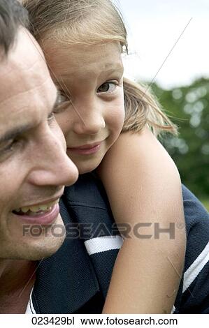 portrait of father carrying young girl piggyback View Large Photo Image Stock Image - portrait of father carrying young girl piggyback. Fotosearch