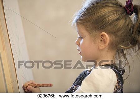 portrait of little girl drawing View Large Photo Image Stock Image - portrait of little girl drawing. Fotosearch