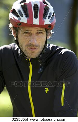 portrait of male cyclist wearing helmet View Large Photo Image Stock Image - portrait of male cyclist wearing helmet. Fotosearch