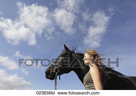 portrait of teenage girl and black horse View Large Photo Image Stock Image - portrait of teenage girl and black horse. Fotosearch