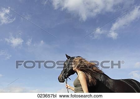 portrait of teenage girl and black horse View Large Photo Image Stock Image - portrait of teenage girl and black horse. Fotosearch