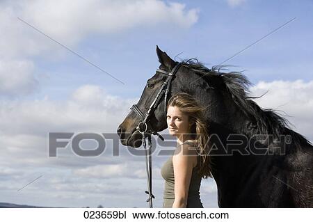 portrait of teenage girl and black horse View Large Photo Image Stock Image - portrait of teenage girl and black horse. Fotosearch