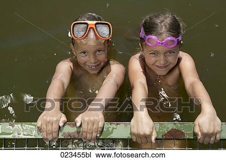 portrait of two girls swimming in lake View Large Photo Image Stock Image - portrait of two girls swimming in lake. Fotosearch