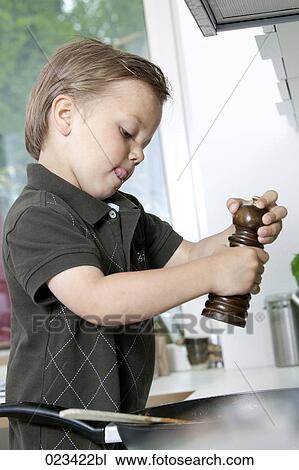 portrait of young boy cooking in kitchen View Large Photo Image Stock Image - portrait of young boy cooking in kitchen. Fotosearch