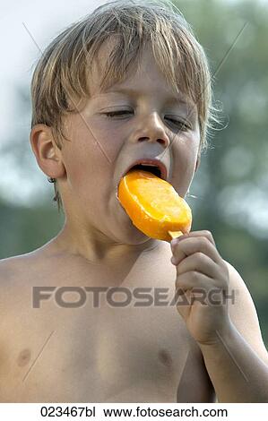portrait of young boy enjoying ice cream View Large Photo Image Stock Image - portrait of young boy enjoying ice cream. Fotosearch