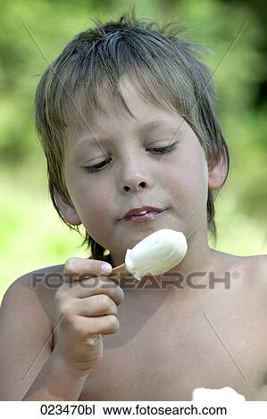 portrait of young boy enjoying ice cream View Large Photo Image Stock Image - portrait of young boy enjoying ice cream. Fotosearch