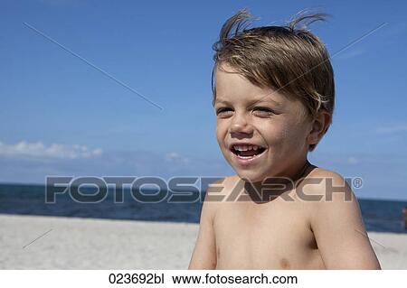 portrait of young boy on beach View Large Photo Image Stock Image - portrait of young boy on beach. Fotosearch