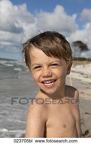 portrait of young boy on beach View Large Photo Image Stock Image - portrait of young boy on beach. Fotosearch