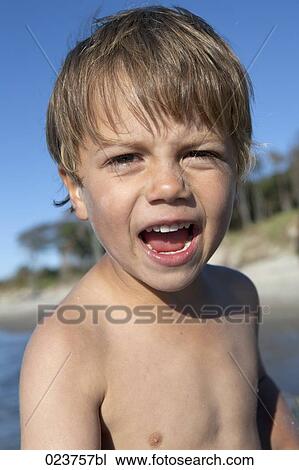 portrait of young boy on beach View Large Photo Image Stock Image - portrait of young boy on beach. Fotosearch