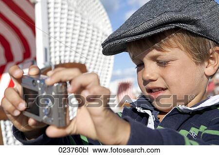 portrait of young boy taking self-portrait with digital camera View Large Photo Image Stock Image - portrait of young boy taking self-portrait with digital camera. Fotosearch
