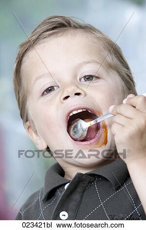 portrait of young boy tasting minced meat View Large Photo Image Stock Image - portrait of young boy tasting minced meat. Fotosearch