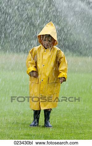 portrait of young boy wearing yellow raincoat View Large Photo Image Stock Image - portrait of young boy wearing yellow raincoat. Fotosearch