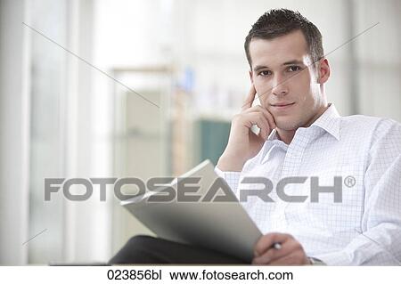 portrait of young businessman with document View Large Photo Image Stock Image - portrait of young businessman with document. Fotosearch