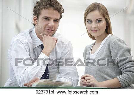portrait of young businesswoman and male colleague View Large Photo Image Stock Image - portrait of young businesswoman and male colleague. Fotosearch