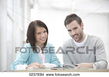 portrait of young businesswoman and male colleague View Large Photo Image Stock Image - portrait of young businesswoman and male colleague. Fotosearch