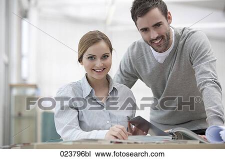 portrait of young businesswoman and male colleague View Large Photo Image Stock Image - portrait of young businesswoman and male colleague. Fotosearch