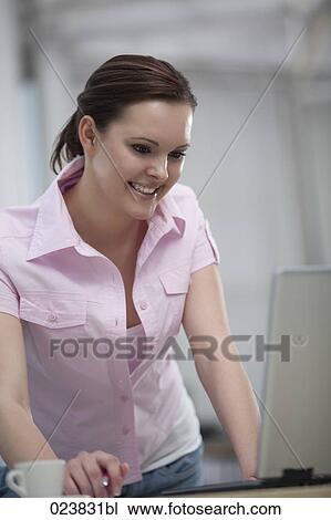 portrait of young businesswoman looking at computer screen View Large Photo Image Stock Image - portrait of young businesswoman looking at computer screen. Fotosearch